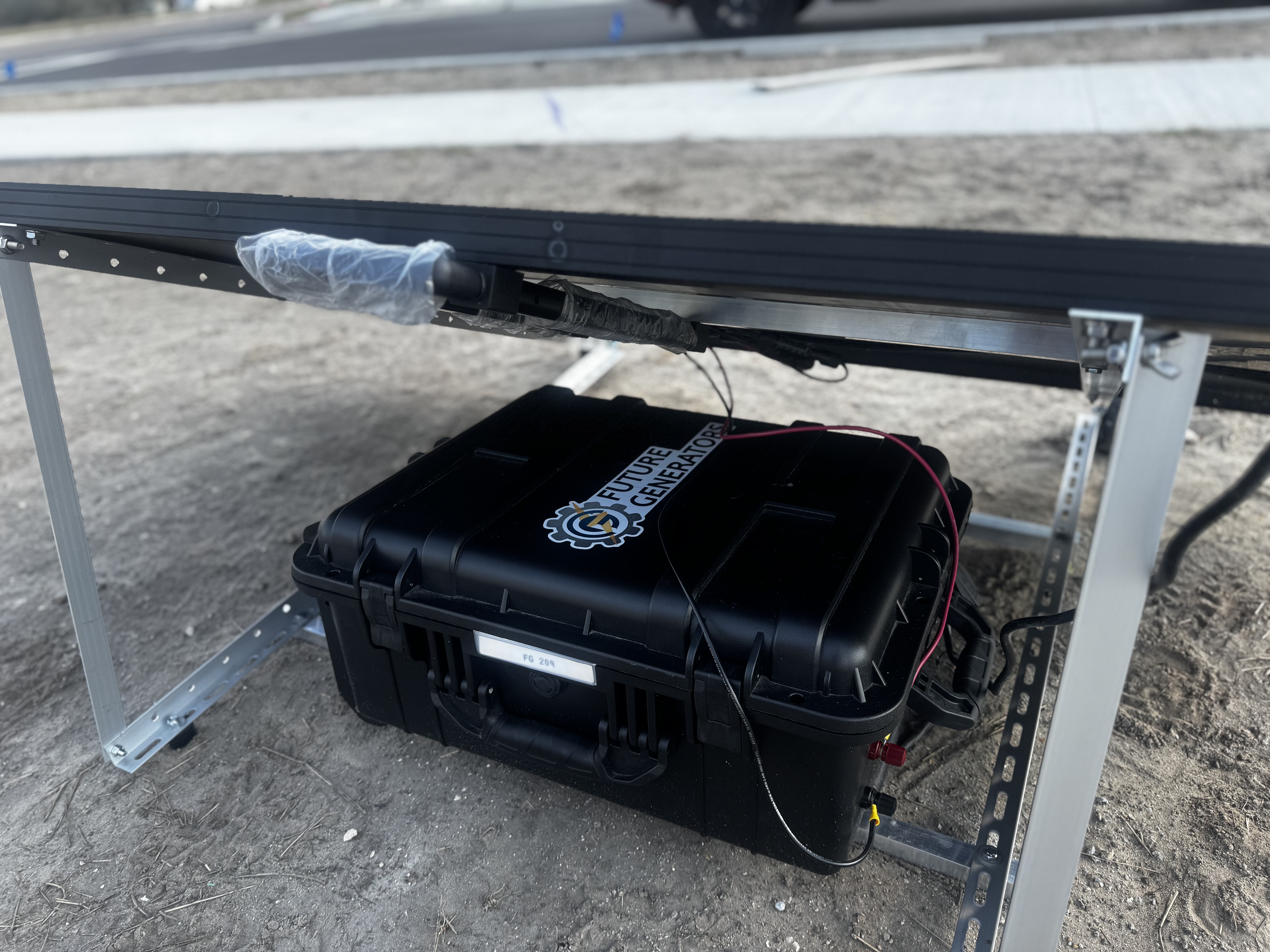 Portable Future Generators solar power unit with a battery case mounted beneath the panel frame